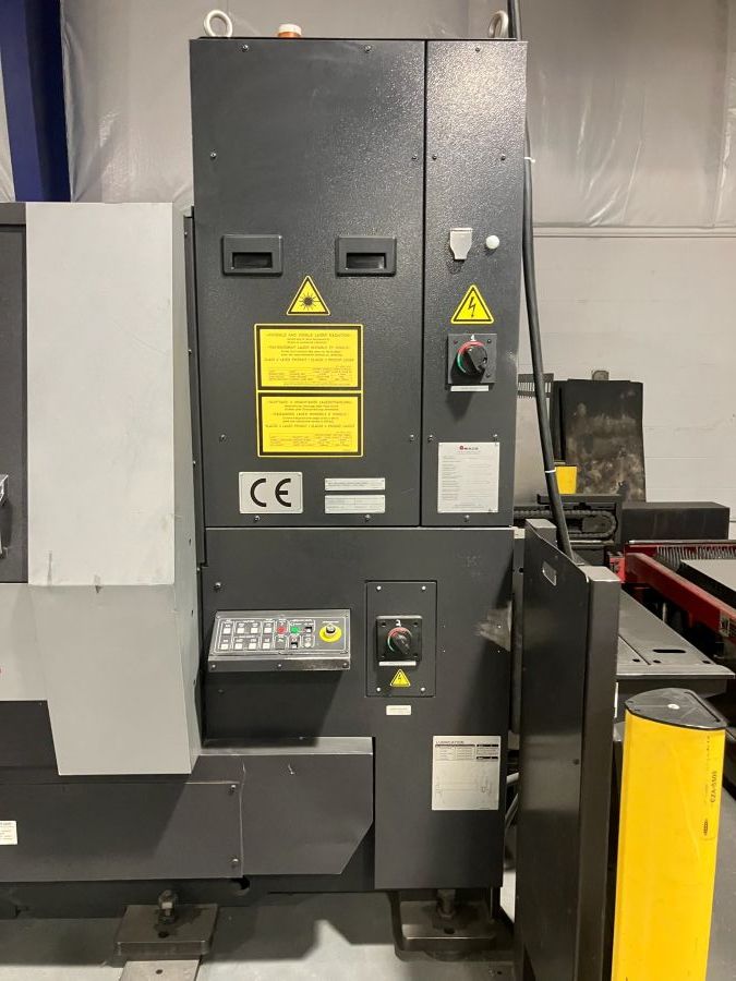 1143-Amada-ENSIS-3015AJ-3kW-Resonator-side-with-shuttle-table-control